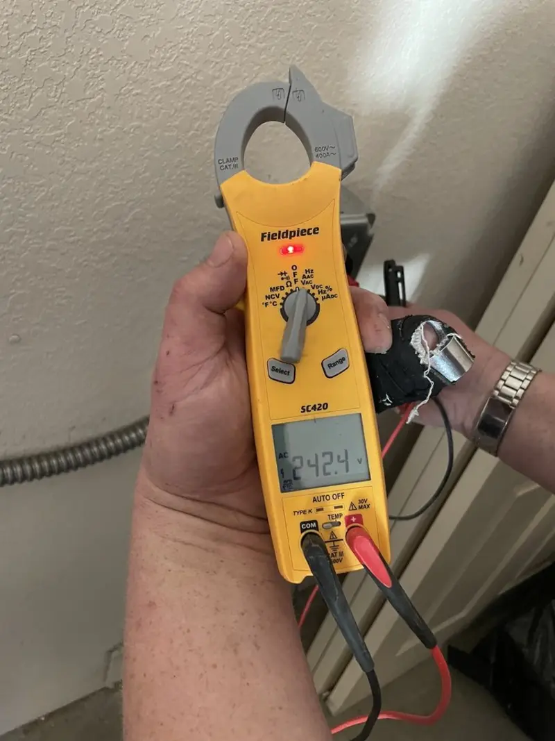 Voltage testing with clamp meter during Recessed Lighting Installation in Urbana
